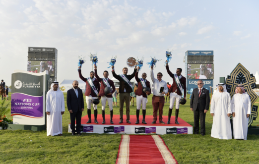 Faisal Al Ali, Vice-President Emirates Equestrian Federation, Patrick Aoun, Brand Manager Longines, winning Qatari team members Ali Yousef Al Rumaihi and Khalid Al Emadi, Chef d’Equipe Willem Meeus, team member Bassem Hassan Mohammed, coach Jan Tops and team member Sheikh Ali Bin Khalid Al Thani, Stephan Ellenbruch, Foreign Judge, Saeed Mohammad Bin Hofaan Al Mansouri, Ghantoot Racing and Polo Club and Ahmad Ali Al Nuami, General Manager Ghantoot Racing and Polo Club. (FEI/Richard Juilliart) 