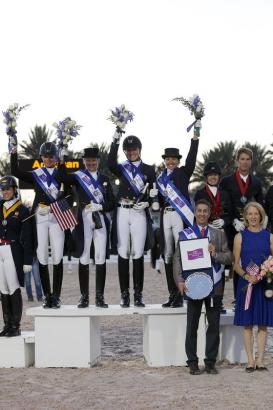 Foto: Team USA 1 - Silva Martin, Tina Konyot, Adrienne Lyle and Shawna Harding - stood on the top step of the podium after emerging victorious in the opening leg of the FEI Nations Cup™ Dressage 2014 pilot series at Wellington, USA - Fotograf: FEI/Sue Stickle