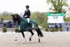 Foto: Trabte mit Bayside AK 2023 in Redefin zum Sieg in der Bundeschampionats-Qualifikation und kommt nun mit drei Grand-Prix-Pferden zurück: Juliane Brunkhorst - Fotograf: Thomas Hellmann